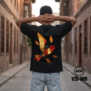 DEDO oversized t-shirt featuring a colorful geometric flying bird print, item code V2B-009.