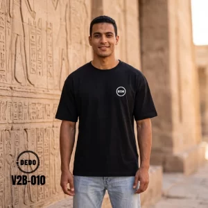 DEDO V2B-010 black oversized t-shirt with circular chest logo in front of Egyptian heritage temple