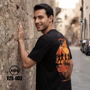 DEDO V2B-003 black oversized T-shirt with Egyptian-inspired back graphic in a historic street